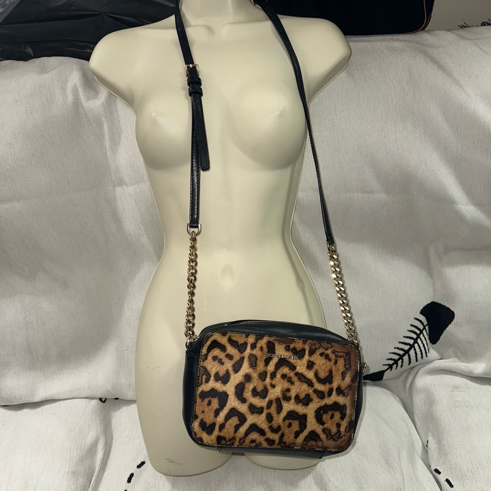 Michael Kors black smooth leather crossbody with hide animal print front panel